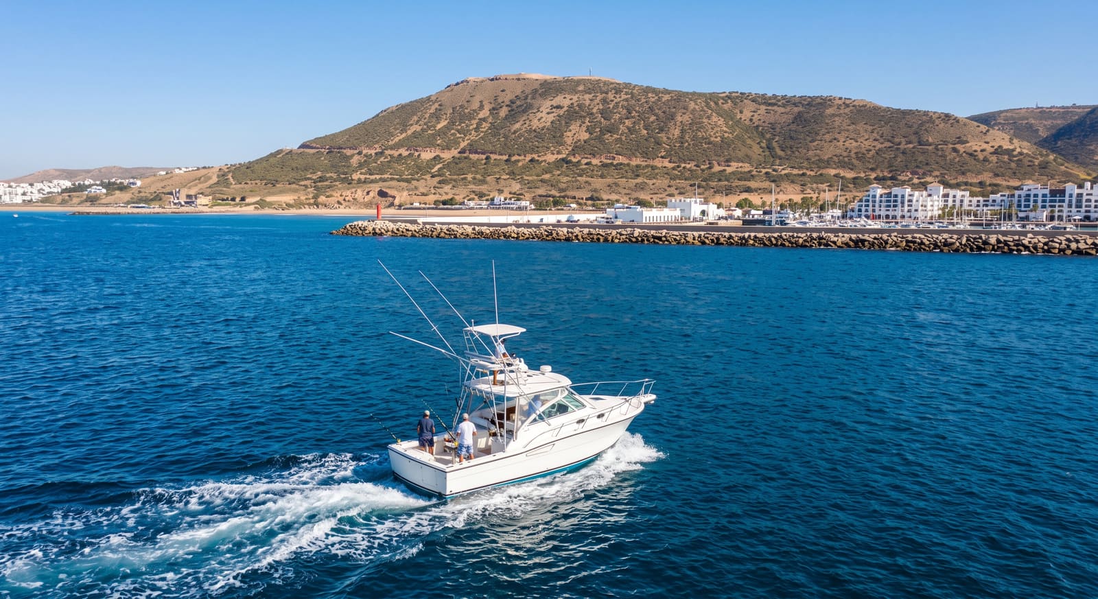 A fishing charter boat departing Agadir marina, one of the adventure day trips a Teefun-planned itinerary can include.